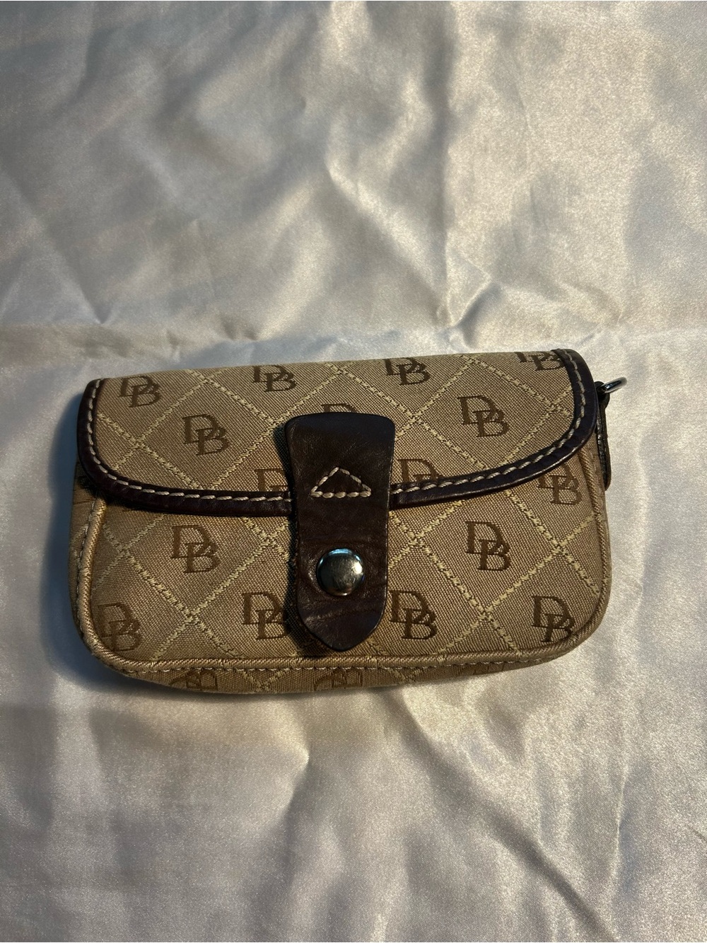 Dooney & Bourke Monogram Tan Canvas women’s wristlet.